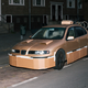 Illustration for article titled This Artist Turns Boring Rides Into Supercars At Night Using Cardboard